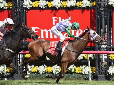 MELBOURNE, AUSTRALIA - NOVEMBER 03: Michelle Payne riding Prince of Penzance defeats Frankie Dettori riding Max Dynamite in race 7, the Emirates Melbourne Cup on Melbourne Cup Day at Flemington Racecourse on November 3, 2015 in Melbourne, Australia. (Photo by Vince Caligiuri/Getty Images)
