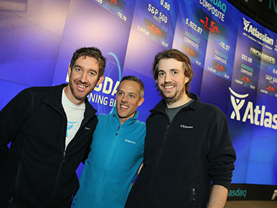 A supplied image obtained Friday, Dec.11, 2015 of the Co-Founders of Sydney technology company Atlassian Scott Farquhar (left) and Mike Cannon-Brookes (right), during the launch of their company's stock on the US Nasdaq market. Aussie tech darling Atlassian has smashed its debut on the US Nasdaq market, with its stock soaring by 32 per cent, valuing the company at $A8 billion and making its co-founders overnight billionaires. (AAP Image/Howorth) NO ARCHIVING, EDITORIAL USE ONLY