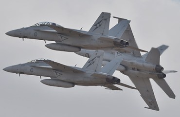Royal Australian Air Force F-18 Hornets perform during the Australian International Airshow at the Avalon Airfield near Lara southwest of Melbourne on February 24, 2015. Some 180,000 patrons were expected through the gates over the duration of the event. AFP PHOTO / Paul CROCK (Photo credit should read PAUL CROCK/AFP/Getty Images)