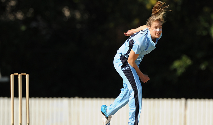 Perry bowls against Queensland at the T20 match in Brisbane last year. Photo: Getty