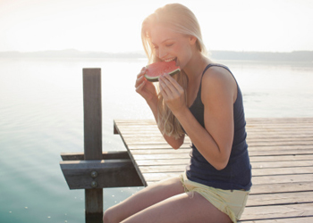 woman eating watermelon savouring