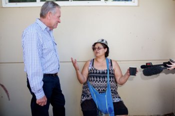 Western Australia Premier Colin Barnett talks with Yarloop resident Ada Farmer, who lost her home in the fire. Photo: AAP
