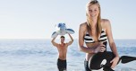 Couple playing with toys on beach
