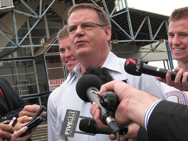 Former South Australian Treasurer Kevin Foley flanked by his two sons speaks during a press conference in his Port Adelaide electorate, Monday, Dec. 12, 2011. Mr Foley ended his 18-year career in state politics saying he planned to start up his own business next year. (AAP Image/Tim Dornin) NO ARCHIVING