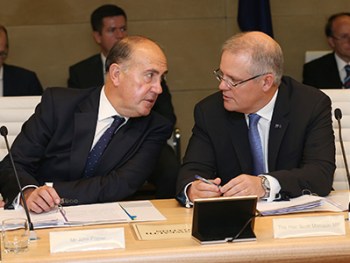 Australian Federal Treasurer Scott Morrison (right) speaks to Secretary To the Treasury John Fraser before meeting state and territory counterparts to discuss tax reform ahead of the COAG leaders' meeting, Sydney, Thursday, Dec. 10, 2015. (AAP Image/David Moir) NO ARCHIVING
