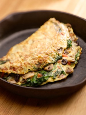 An omelette with toast or muesli and yoghurt are ideal breakfast choices. Photo: Getty