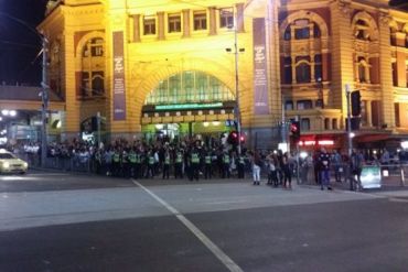 Police patrol Flinders St station amid violent clashes in the city. Photo: Twitter
