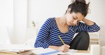 Asian student studying at table