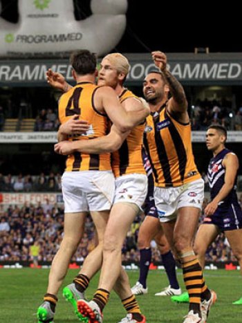 Suckling is mobbed following his famous goal after the three-quarter-time siren in the 2015 preliminary final. Photo: Getty