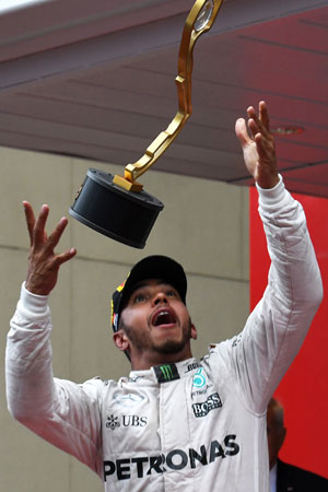 Hamilton celebrates his victory. Photo: Getty