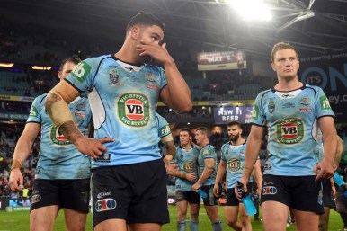 Dejected Blues players after their narrow loss. Photo: AAP.