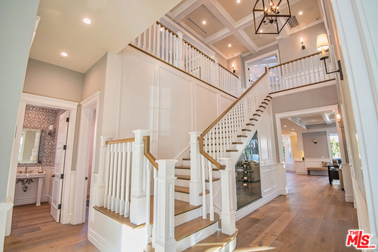A grand foyer greets visitors to the home. 