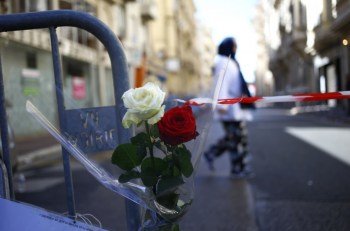 Roses at a barrier near the scene after a truck attack in Nice.