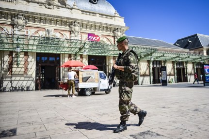 Armed soldiers patrol near Nice Train Station. Photo: AAP.