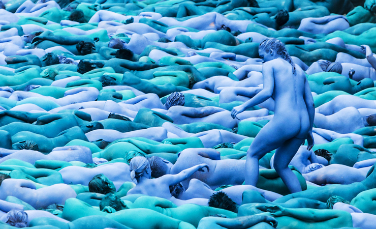 EDS NOTE: NUDITY NO CROPPING ALLOWED. People manoeuvre into position as they take part in a mass nude art installation entitled Sea of Hull by New York based artist Spencer Tunick in Hull, England, Saturday July 9, 2016. Thousands of people stripped nude and are painted various shades of blue to participate in a huge installation at various locations in the sea side city on England's east coast, celebrating the cityís maritime heritage. (Danny Lawson / PA via AP) EDS NOTE: NO CROPPING ALLOWED - NO COMMERCIAL USE - UNITED KINGDOM OUT - NO SALES - NO ARCHIVE
