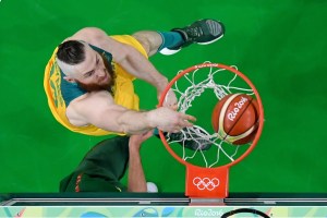 Australia's Aron Baynes dunks against Lithuania during the quarterfinal match. Photo: Getty/pool