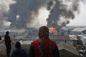 Jungle migrant camp Calais flames
