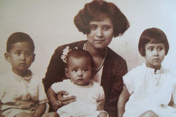 A baby photo of Bhumibol Adulyadej (C) with his mother and siblings Ananda Mahidol (L) and Galyani Vadhana (R)