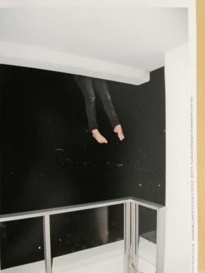 A Queensland Police Service officer hangs her legs off Gable Tostee's Surfers Paradise balcony in a re-enactment in 2014 of Warriena Wright's fatal fall. Photo: Queensland Police Service