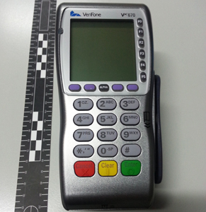 This compromised eftpos machine was seized by police from a Sydney taxi in 2014. Photo: AAP