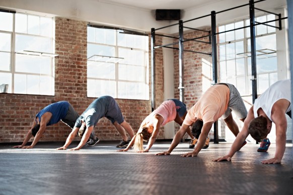 Take up yoga and perfect your downward-facing dog. Photo: Getty