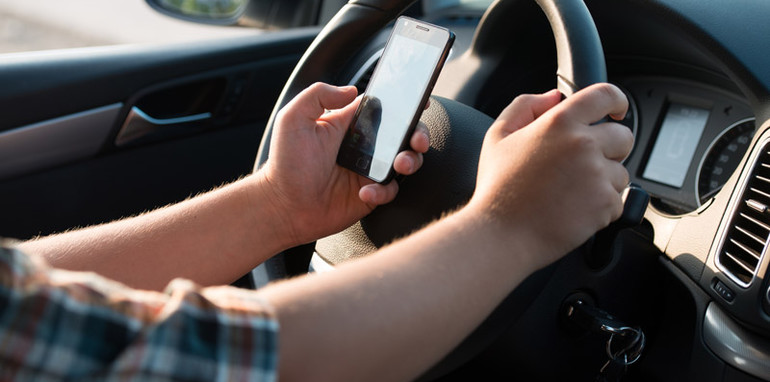 Should texting whilst driving be made safer or banned completely?