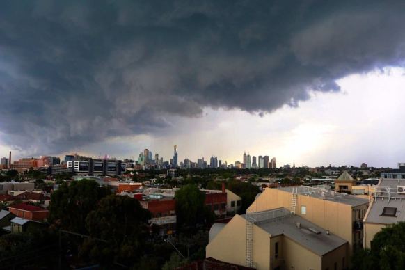 Storm clouds gather over Melbourne before a deluge.