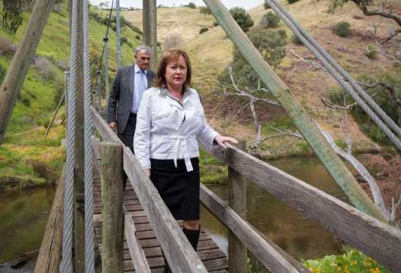 Prosecutor Sandi Mcdonald leads detectives and the Prosecution team along the banks of the Onkaparinga River, a location where the accused Dieter Pfennig frequented in his canoe. Photo: AAP.