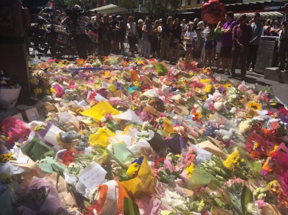 Hundreds of flowers, teddy bears laid in tribute to the Bourke St victims. Photo: Twitter.