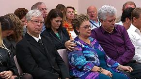 Michael sits next to his former wife Lindy at the fourth coronial inquest into the disappearance of Azaria in 2012.