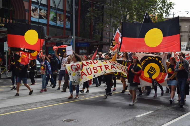 Hundreds of protesters marching against the celebration of Australia Day. Photo: Newzulu