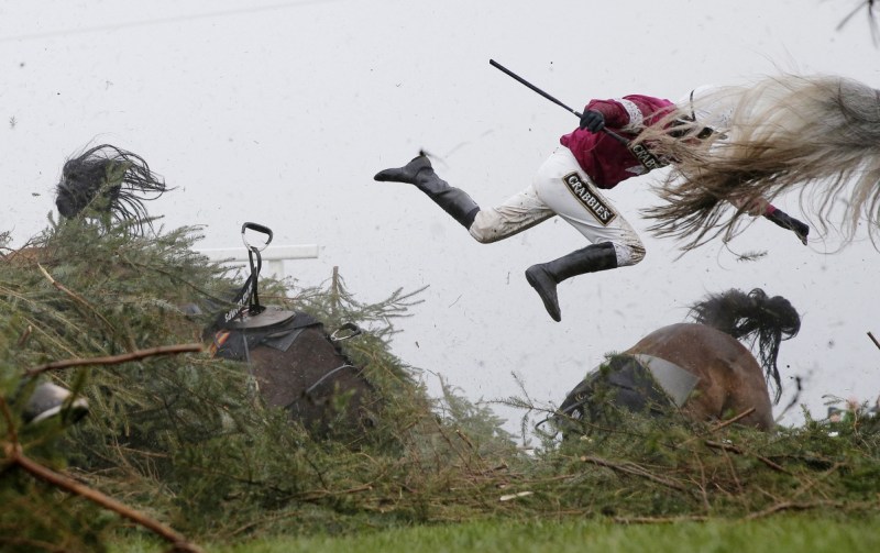 Tom Jenkins, of The Guardian, won best sports photo for this image of jockey Nina Carberry flying off her horse during the Grand National steeplechase. Photo: Tom Jenkins/The Guardian