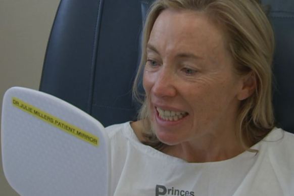 Susie Robinson looks at her smile