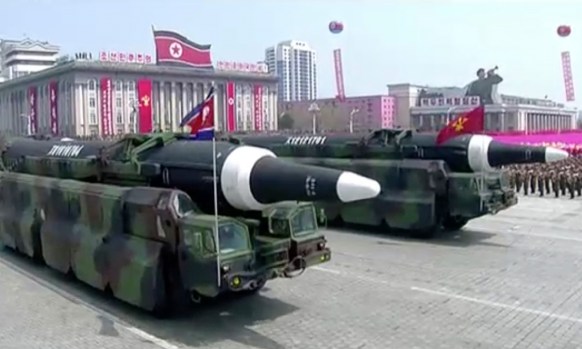 North Korea shows its strength as missiles are paraded.