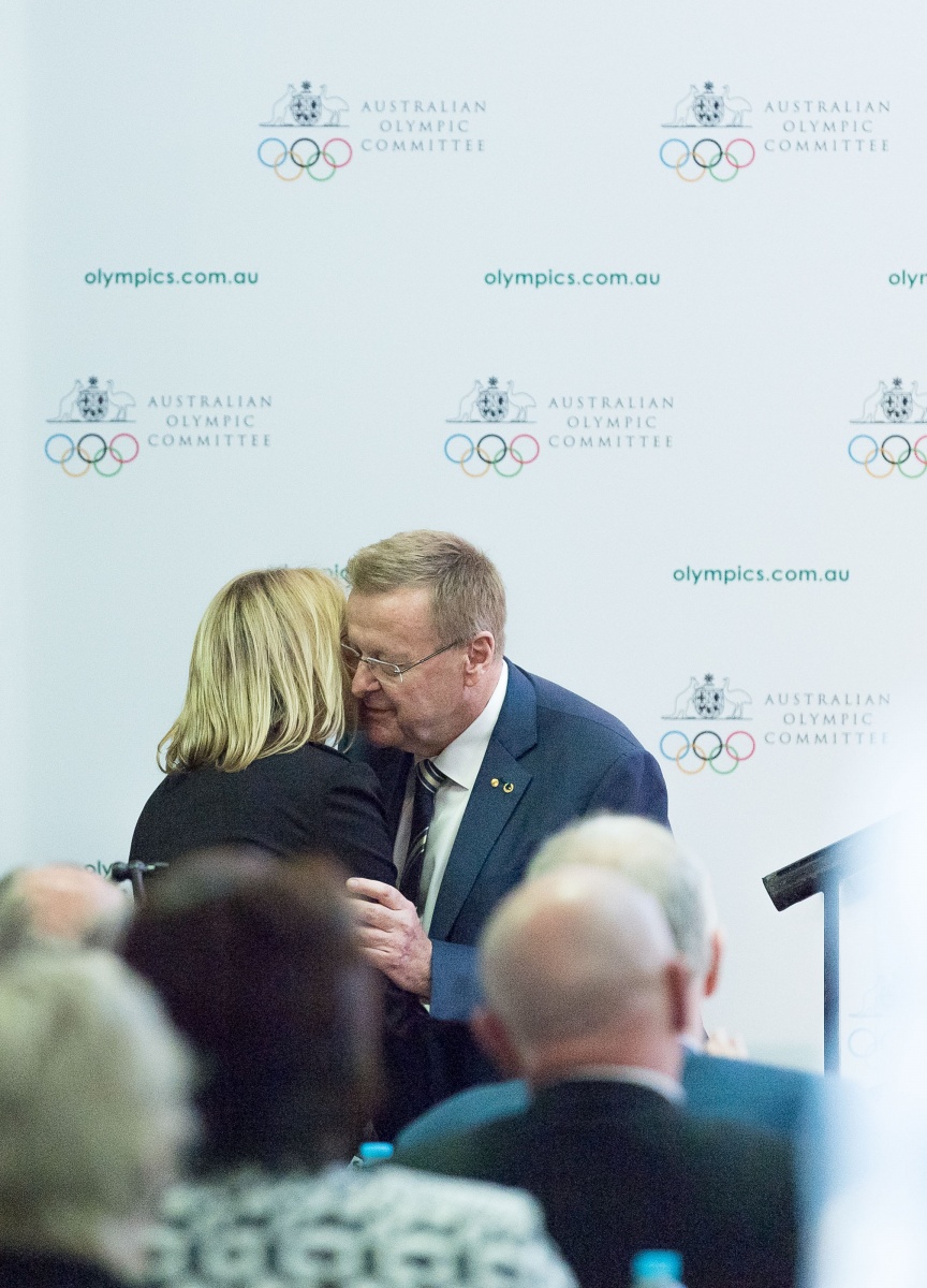 AOC President John Coates embraces Danni Roche after he retains presidency winning the vote during the AOC meeting on Saturday. Photo: AAP