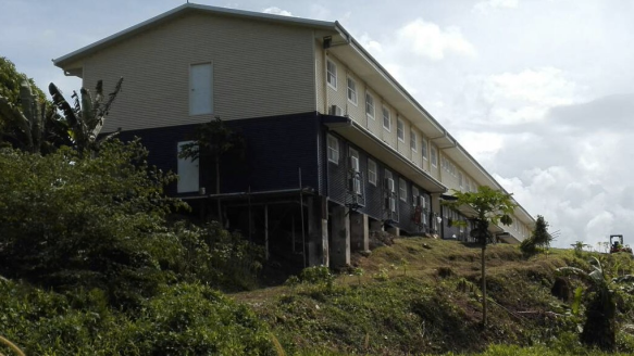 Machinery can be seen at the site as overgrowth is cleared.