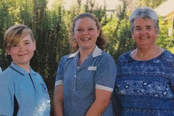 Principal Julie Twitt, who has been at the school 26 years, with the final two pupils — Year 5 student Christopher Jeffrey and Year 6 student Caitlyn McCarthy.