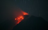 Lava glows at the crater of Mount Sinabung in Indonesia