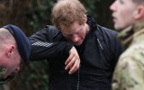 Prince Harry in Datchet, Berkshire, helps sandbag.