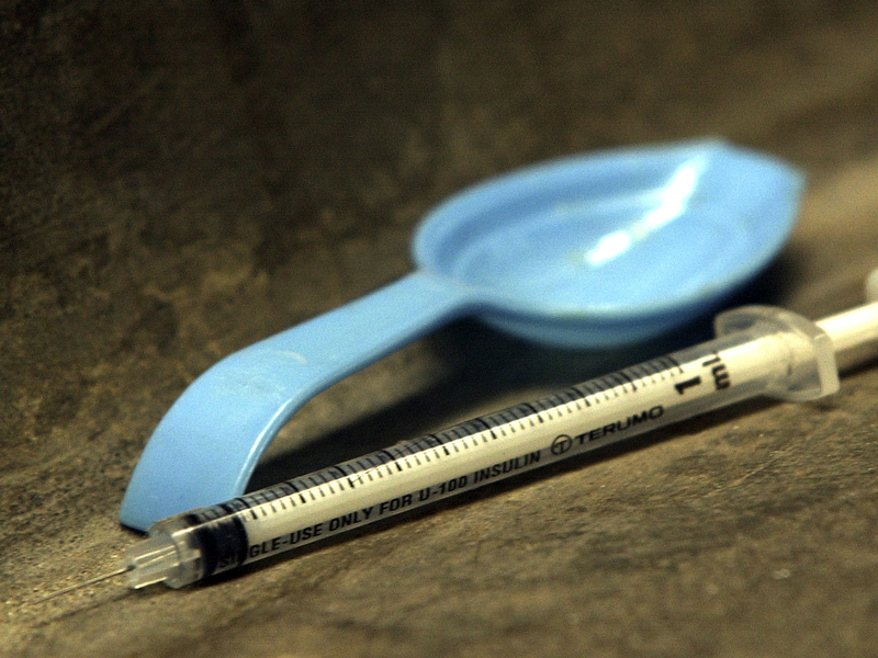 File photo of a spoon and syringe in a gutter