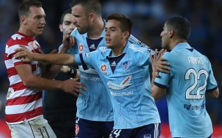 Ali Abbas (right) is restrained by teammate Hagi Gligor.