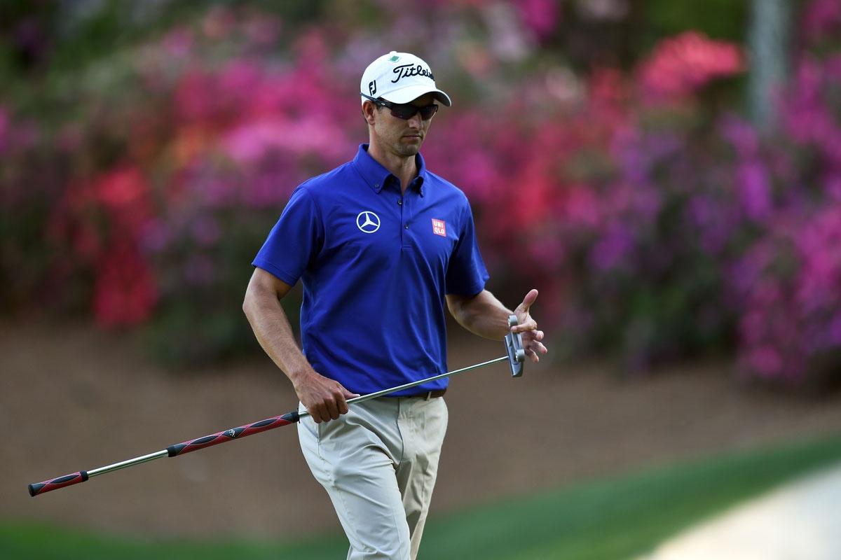 Adam Scott's chances of defending the US Masters green jacket rolled away on the Augusta greens.