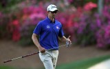 Adam Scott's chances of defending the US Masters green jacket rolled away on the Augusta greens.
