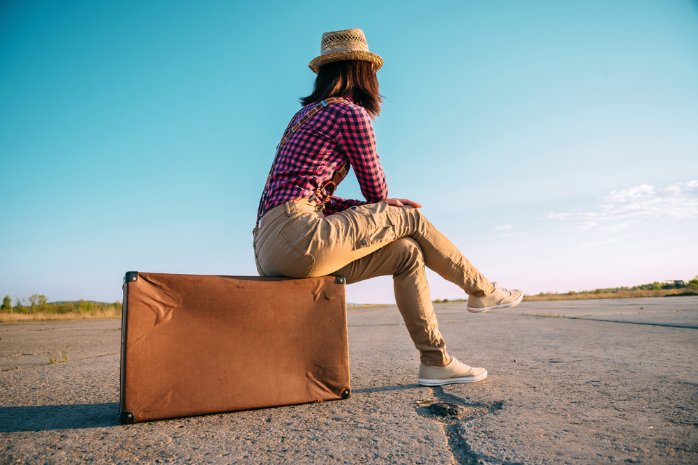 Travel suitcase woman road