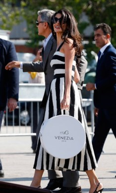 Alamuddin's Dolce and Gabbana gown, with monogrammed hatbox, was magic. Photo: AAP
