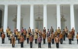 Indonesian President Joko Widodo poses for photos with members of his cabinet.