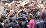 Rescue workers search the rubble after a building collapse in Cairo.