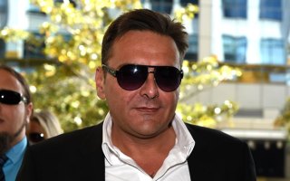 Sydney underworld figure George Alex arrives at the Downing Centre Local Court.