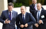 Poland's Foreign Minister Grzegorz Schetyna (centre) with entourage. AAP
