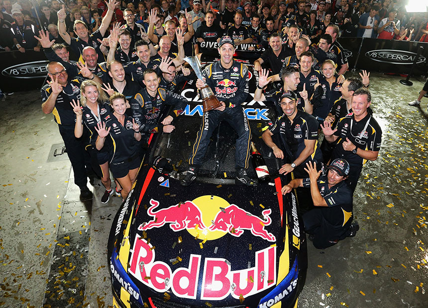 Jamie Whincup and team after being presented with the V8 Supercar Championship trophy.